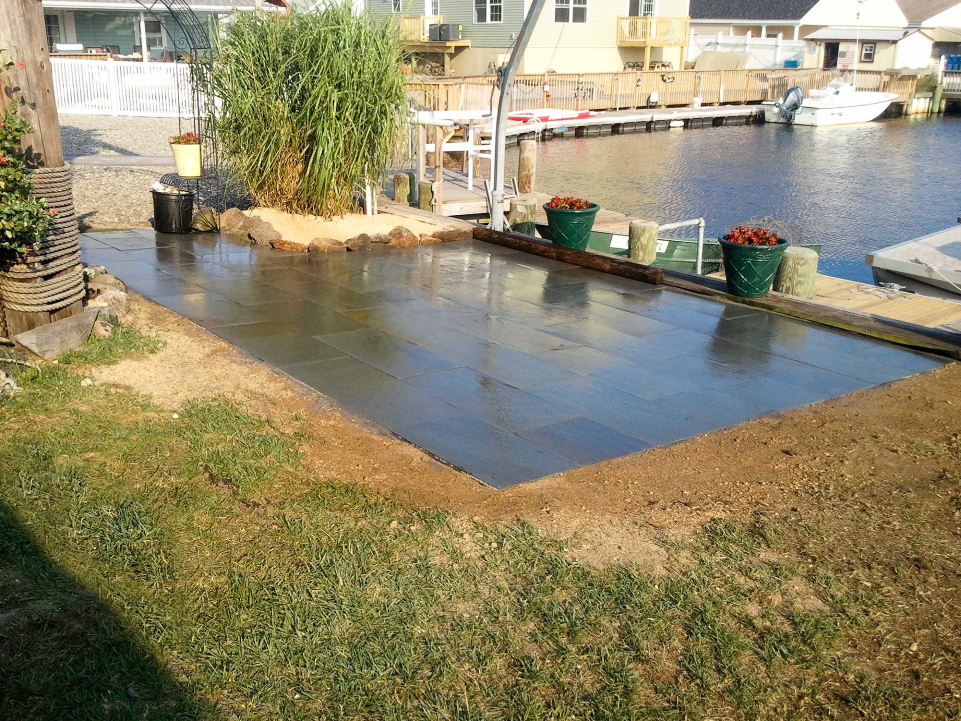 Country Lawn Care Inc waterfront bluestone patio on bay